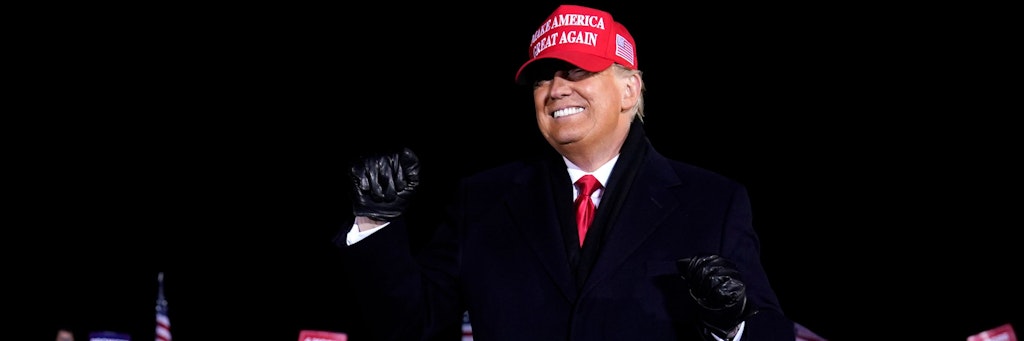 President Donald Trump dances after a campaign rally at Gerald R. Ford International Airport, early Tuesday, Nov. 3, 2020, in Grand Rapids, Mich. (AP Photo/Evan Vucci)