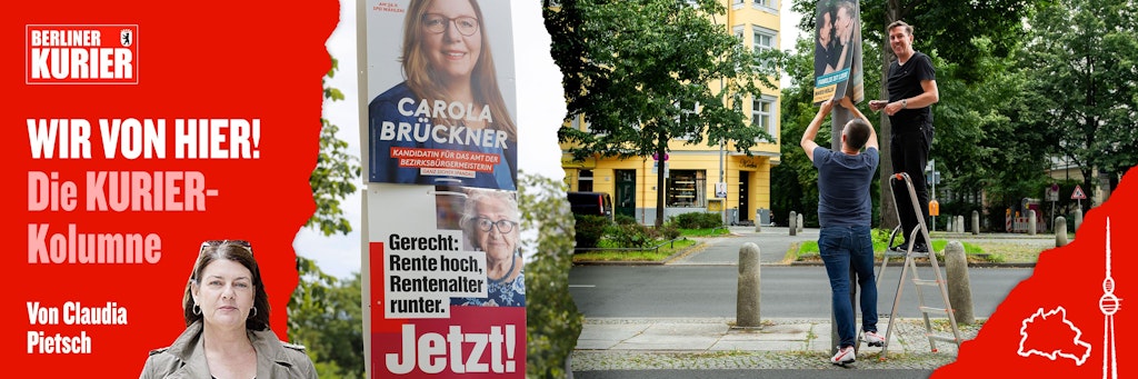 Wahlkampfhelfer befestigen in Berlin Plakate an einem Laternenmast.