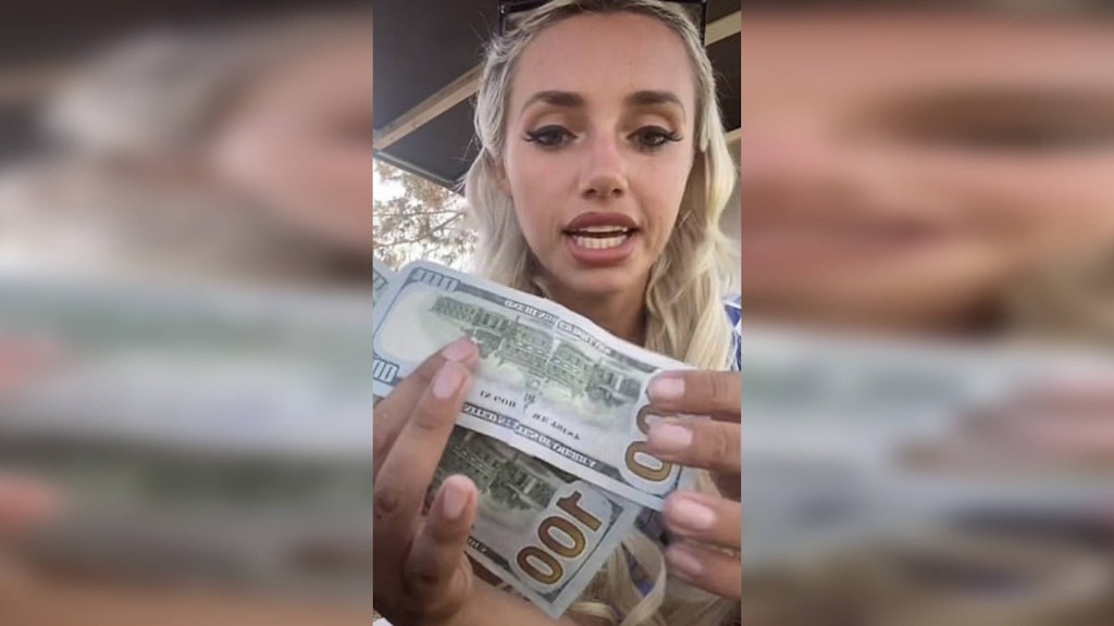 Cassie Holland zeigt: Sie hat die 100-Dollar-Scheine wieder zusammengeklebt.