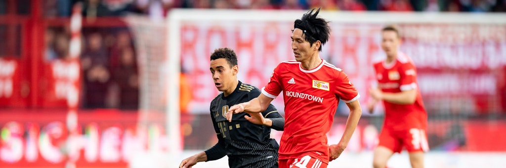 Unions Genki Haraguchi (r.) – hier im Duell mit Bayerns Jamal Musiala – kommt immer besser bei den Eisernen in Schwung. 
