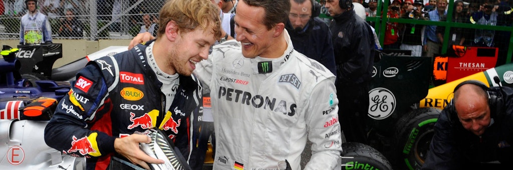 Son war es 2012 nach dem Rennen: Schumi strahlt nach Platz 7, Sebastian Vettel (l.) reichte Rang 6 für seinen dritten WM-Titel. 