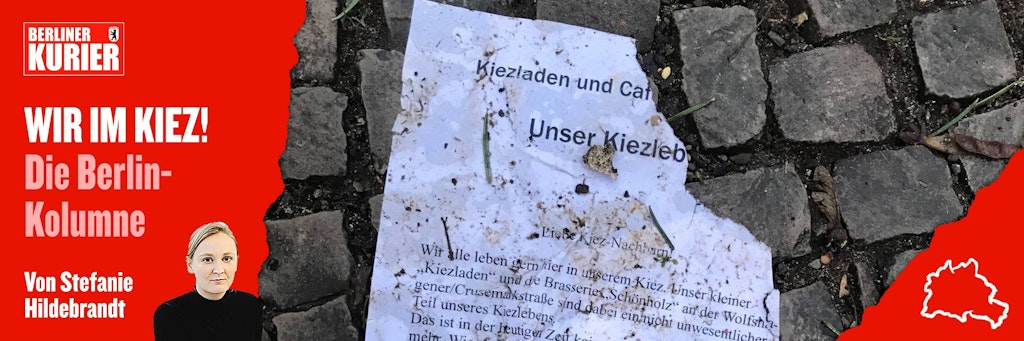 Ein abgerissener Aufruf liegt auf dem Straßenpflaster. Menschen setzen sich für ein gutes Leben im Kiez ein.