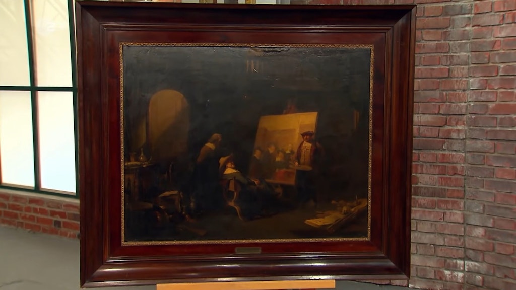 Das Bild bei „Bares für Rares“ zeigt eine Szene, in der Rembrandt in seinem Atelier neben seinem unvollendeten Bild der Tuchmacherzunft steht.