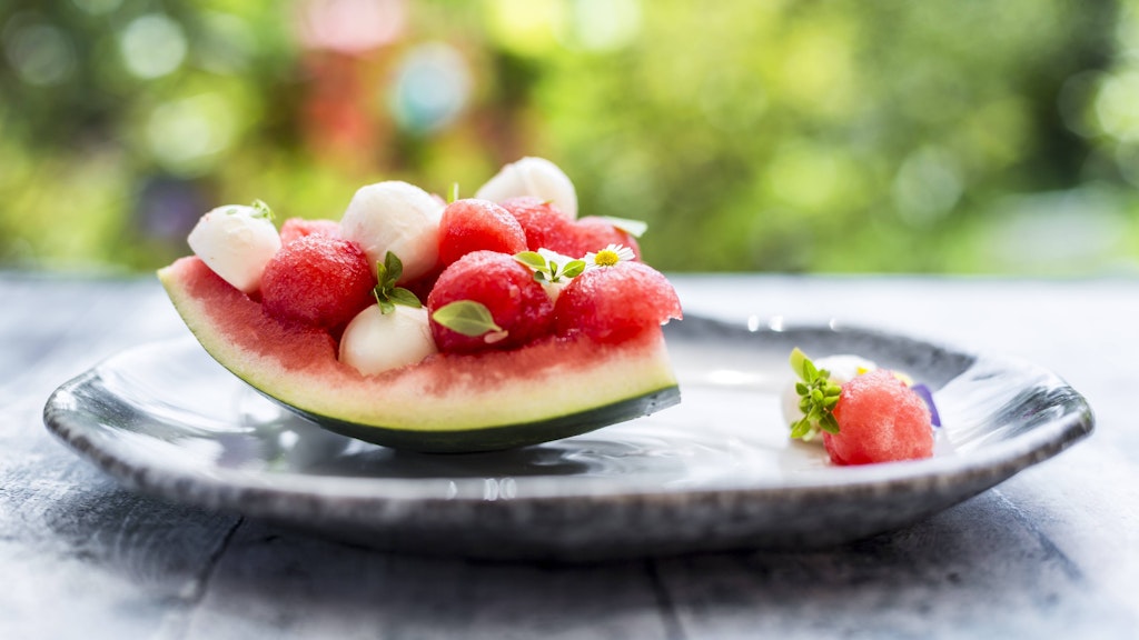 For example, a watermelon salad with feta can be served on a plate.