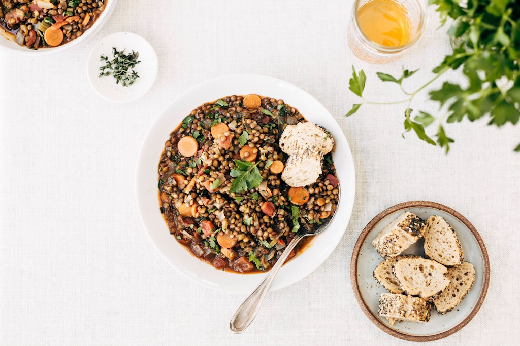 According to the recipe, lentil soup acquires its special taste from vinegar and sugar.